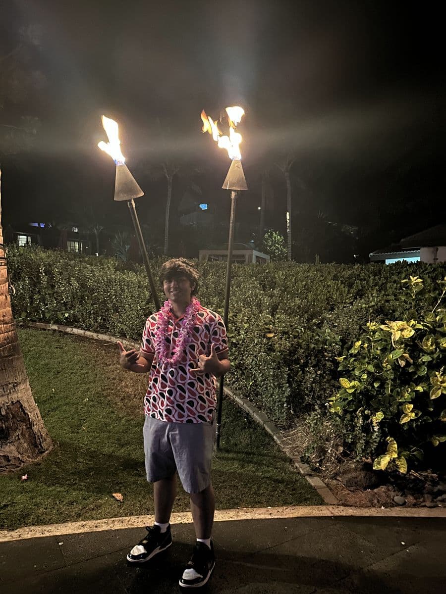 Anikhet at a torch-lit luau